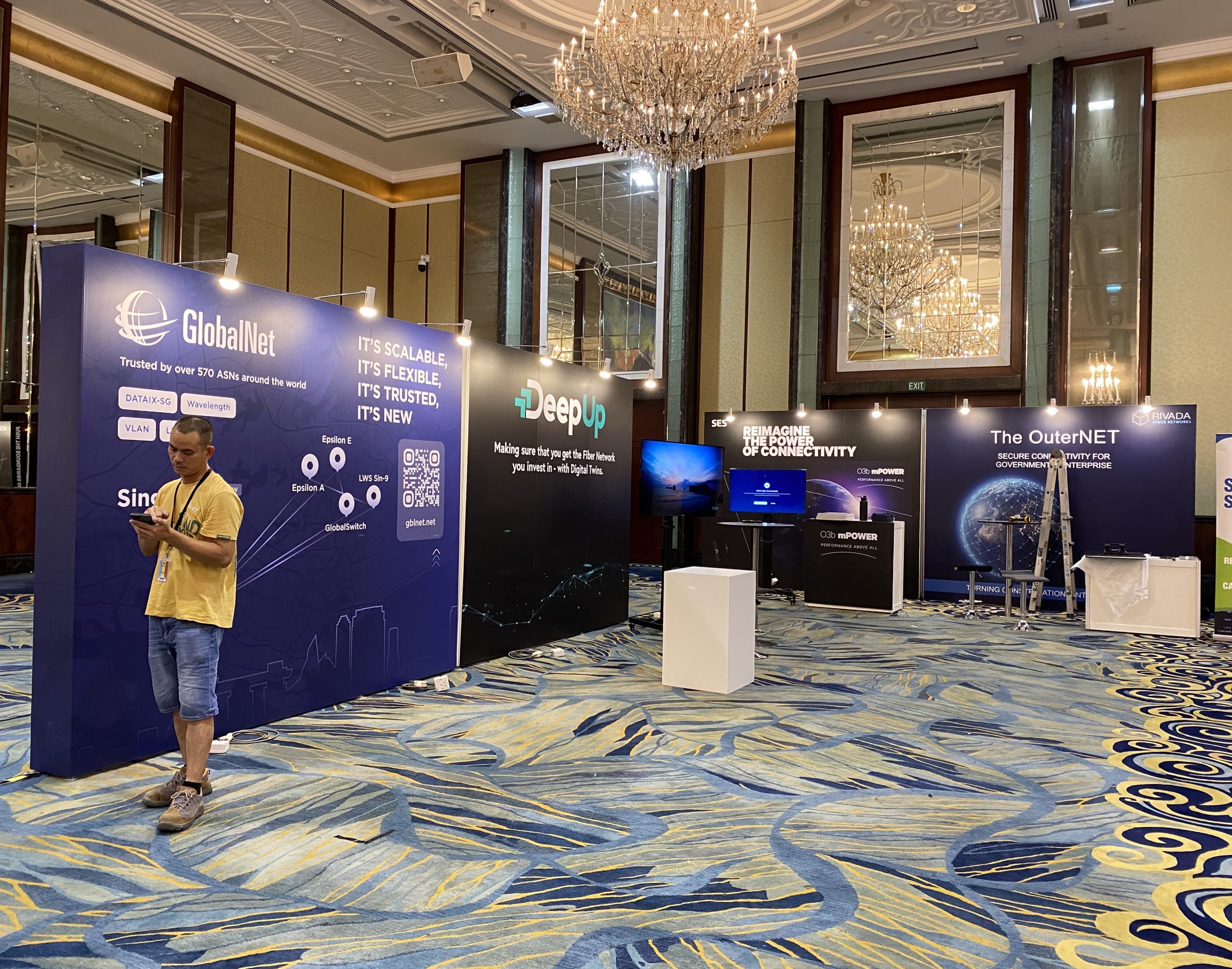 Conference exhibition setup for Capacity Asia 2023 at Shangri-La Ballroom, Singapore.