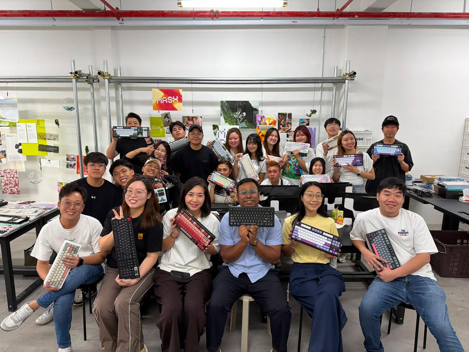 Zeno team showing their keyboards at a workshop